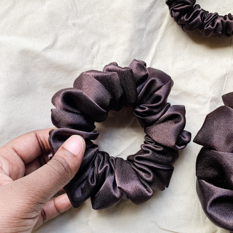 Fresh Brew coffee brown chunky scrunchie made from luxe charmeuse satin. Oversized design, approximately twice the size of a standard scrunchie, with a smooth, glossy finish that adds a touch of elegance and volume to any hairstyle.