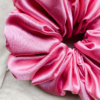 Blush Bloom XL scrunchie in blush pink, made from luxurious charmeuse silk. Four times the size of the chunky scrunchie, this oversized scrunchie offers an extravagant, voluminous look with a smooth, glossy finish, perfect for making a bold statement or securing hair comfortably.