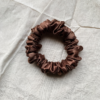 Coco Dream cocoa brown petite scrunchie made from luxe charmeuse satin. Oversized design, approximately twice the size of a standard scrunchie, with a smooth, glossy finish that adds a touch of elegance to any hairstyle.