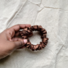 Coco Dream cocoa brown petite scrunchie made from luxe charmeuse satin. Oversized design, approximately twice the size of a standard scrunchie, with a smooth, glossy finish that adds a touch of elegance to any hairstyle.