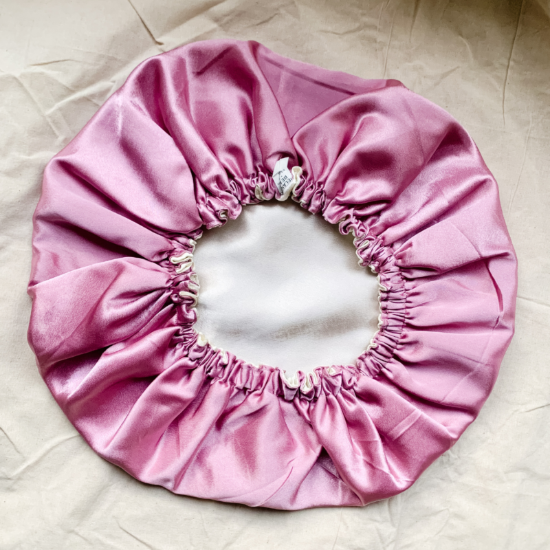 Dusky Rose dusty pink and ivory bonnet made from luxe charmeuse satin. Oversized design, approximately twice the size of a standard scrunchie, with a smooth, glossy finish that adds a touch of elegance and volume to any hairstyle.