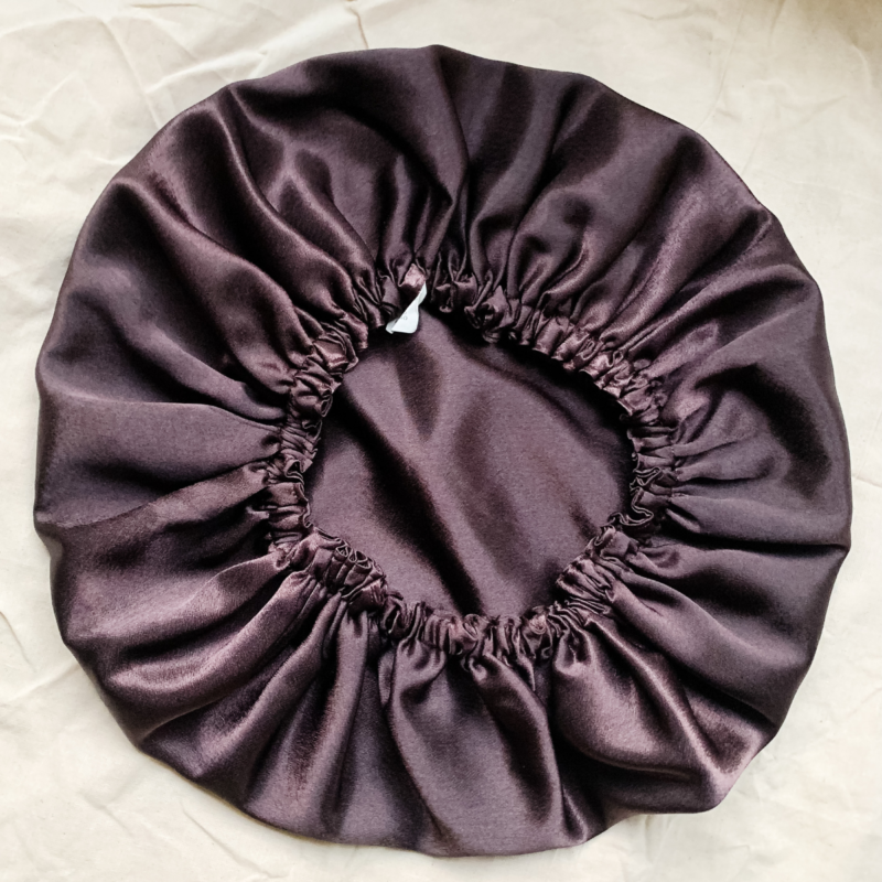 Fresh Brew reversible silk bonnet in coffee brown. Made from smooth charmeuse silk, this bonnet features a comfortable elastic band for a secure fit, offering a soft, luxurious touch for protecting hair while sleeping or resting.