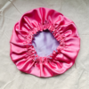 Lavender Blossom Silk Bonnet for Kids – Protects hair from frizz and moisture loss while sleeping. Made from soft charmeuse silk in lavender and rose pink, fits most children ages 2-6.