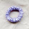 Lavender petite scrunchie made from luxe charmeuse satin. Oversized design, approximately twice the size of a standard scrunchie, with a smooth, glossy finish that adds a touch of elegance to any hairstyle.