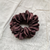 Melanin Magic deep brown chunky scrunchie made from luxe charmeuse satin. Oversized design, approximately twice the size of a standard scrunchie, with a smooth, glossy finish that adds a touch of elegance and volume to any hairstyle.