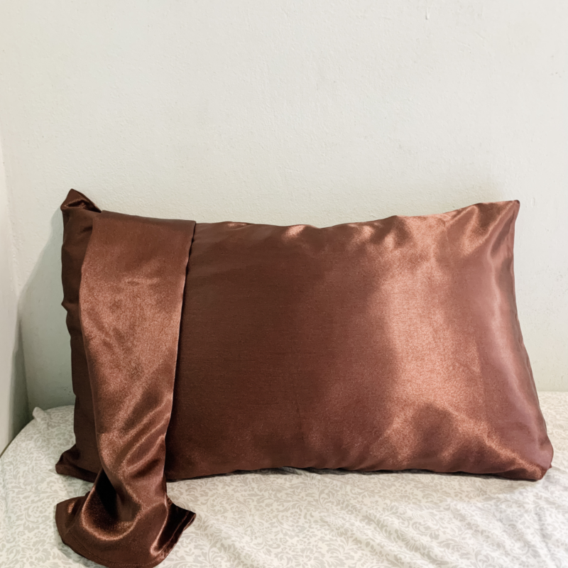 Melanin Magic Charmeuse Silk Pillowcase – Dark Brown in color, made from 100% luxurious charmeuse silk, offering a smooth and soft texture for a restful night's sleep.