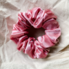 Peach Fizz peachy pink chunky scrunchie made from luxe charmeuse satin. Oversized design, approximately twice the size of a standard scrunchie, with a smooth, glossy finish that adds a touch of elegance and volume to any hairstyle.