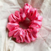 Rosette rose pink chunky scrunchie made from luxe charmeuse satin. Oversized design, approximately twice the size of a standard scrunchie, with a smooth, glossy finish that adds a touch of elegance and volume to any hairstyle.