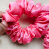 Rosette rose pink chunky scrunchie made from luxe charmeuse satin. Oversized design, approximately twice the size of a standard scrunchie, with a smooth, glossy finish that adds a touch of elegance and volume to any hairstyle.