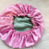 strawberry matcha latte bonnet flipped on the reverse showcasing the strawberry porting of the bonnet.
