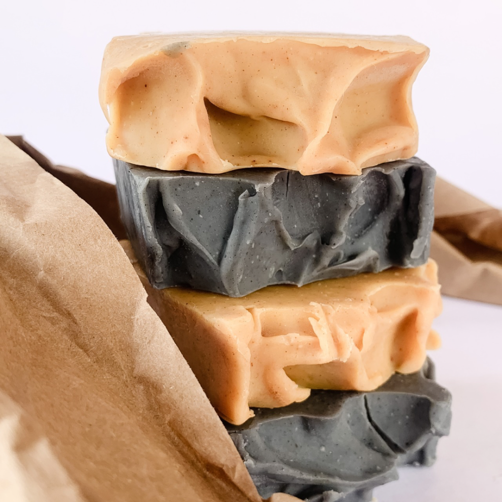A soap stack featuring our besting Glow On (Turmeric & Carrot) and Detox (Charcoal & Peppermint) Soap Bars